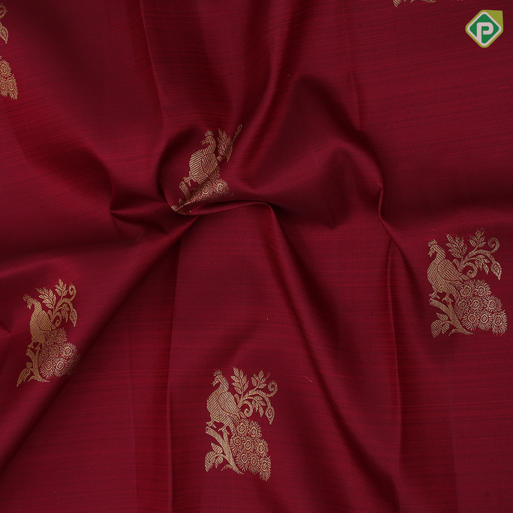 Maroon gold zari peacock on branch butta self multi classic symbol butta lines border traditional silk saree