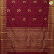 Maroon gold zari peacock on branch butta self multi classic symbol butta lines border traditional silk saree