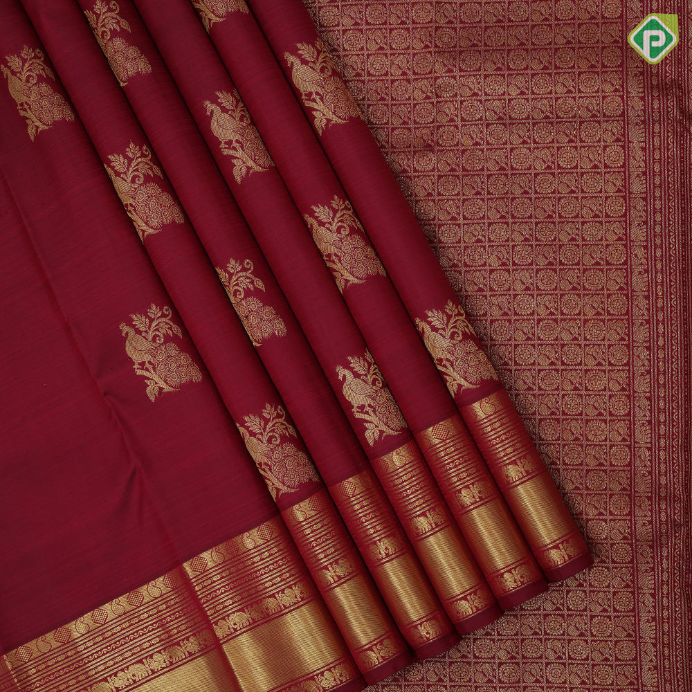 Maroon gold zari peacock on branch butta self multi classic symbol butta lines border traditional silk saree