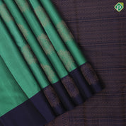 Teel green copper zari fancy flower butta contrast blue copper zari flower border pure mix soft silk saree