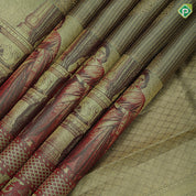 Mint green gold zari kattam checked round butta self thamayanthi stading posture art effect painting signature silk saree