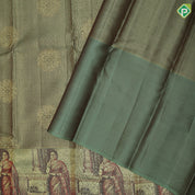 Mint green gold zari kattam checked round butta self thamayanthi stading posture art effect painting signature silk saree