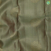 Mint green gold zari kattam checked round butta self thamayanthi stading posture art effect painting signature silk saree