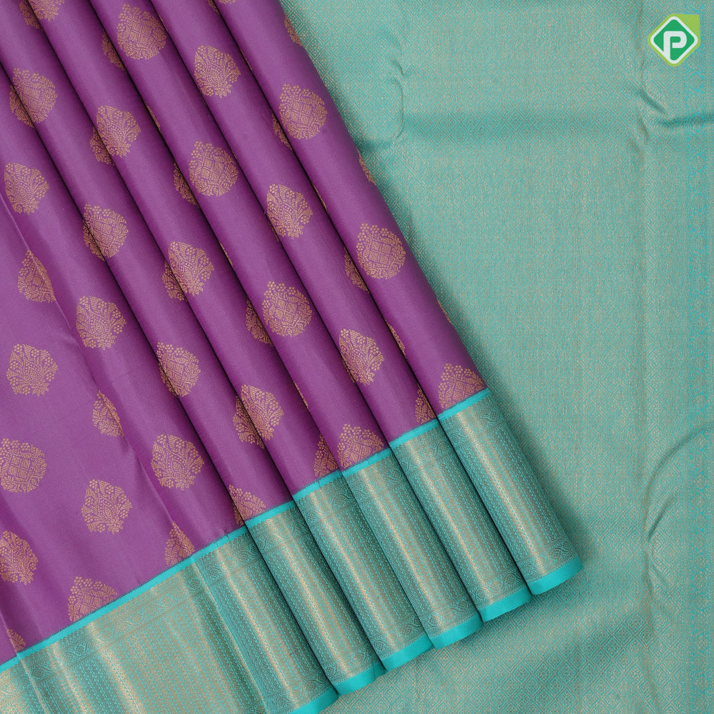 Lavender gold zari thilagam butta design rama green gold zari zig zag border traditional silk saree