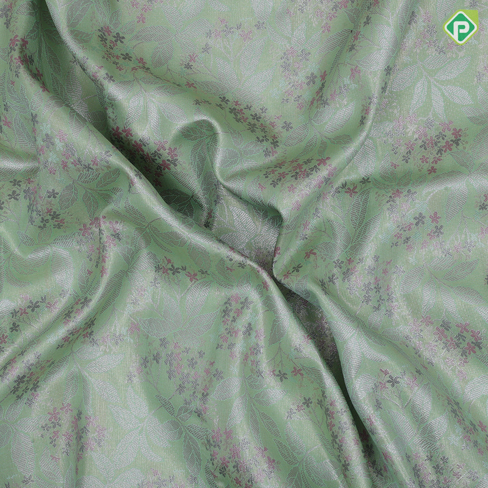 Pista green silver zari and multi color floral design contrast double color center border tissue art silk saree