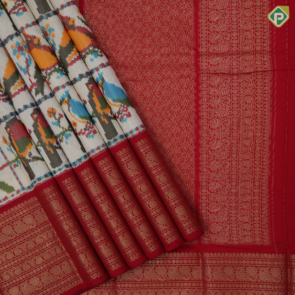 Sandal base multi color ikkat design red gold zari multi butta design koorvai border fusion silk saree