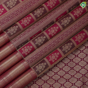 Purple base flower bunch in frame grand design self gold zari micro diamond border grand bridal silk saree