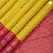 yellow base gold zari checked annam chakkaram butta contrast pink gold zari meena work lines border traditional silk saree