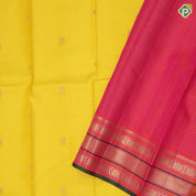 yellow base gold zari checked annam chakkaram butta contrast pink gold zari meena work lines border traditional silk saree