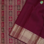 Purple base flower bunch in frame grand design self gold zari micro diamond border grand bridal silk saree