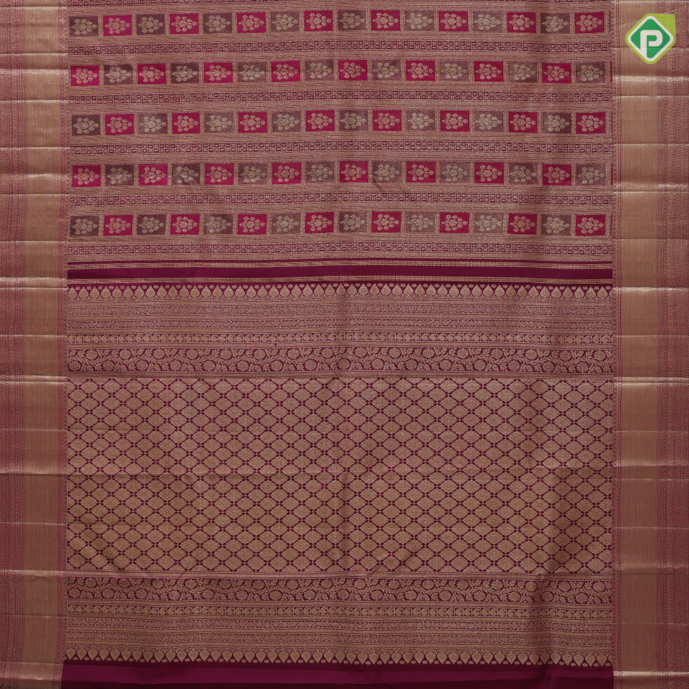 Purple base flower bunch in frame grand design self gold zari micro diamond border grand bridal silk saree