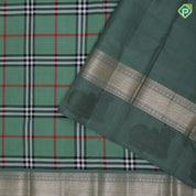 Sage green base multi color barbarian madras checks design self silver gold zari thread nandi butta border traditional silk saree