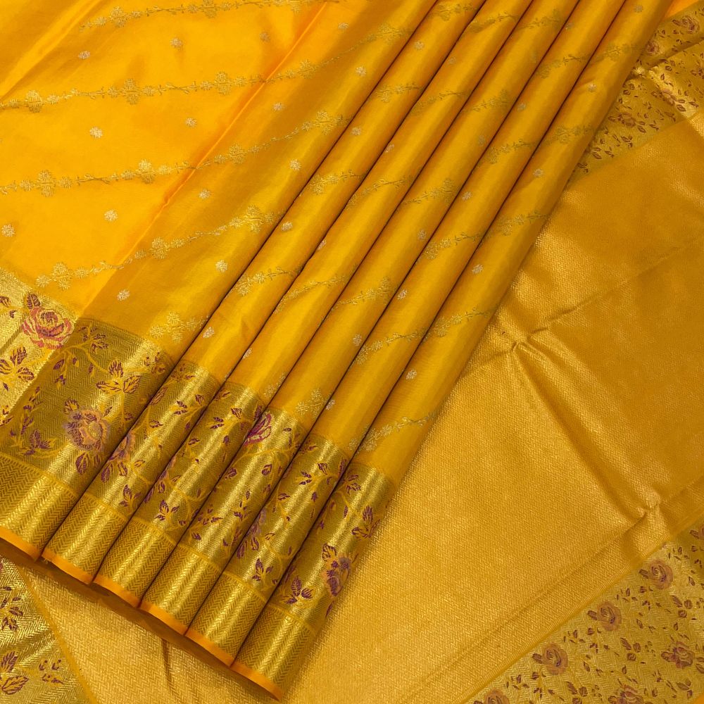 Orangish Yellow Silk Thread Pythonic Design Border Exclusive Grand Silk Saree
