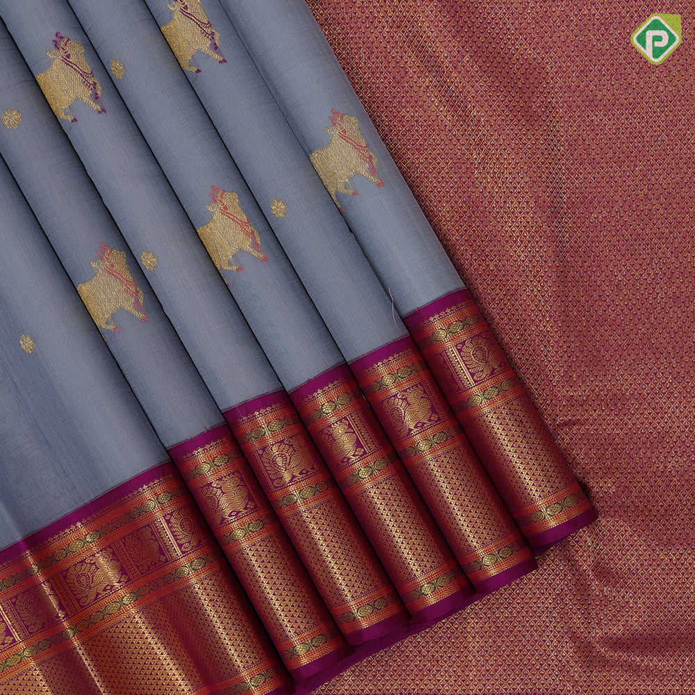 blueish grey gold zari thread work cow butta design contrast purple gold peacock butta mayilkan border pichwai silk saree