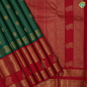 Forest green gold zari vairaoosi peacock chakkaram contrast red gold zari gaja yaali butta border traditional vintage silk saree