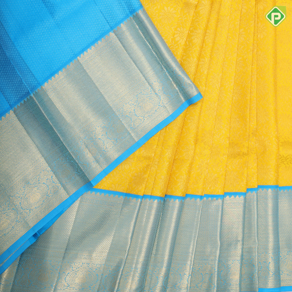 mango yellow gold zari grand floral design deep sky blue gold zari micro diamond border pattu paavadai thavani  3 in 1 set