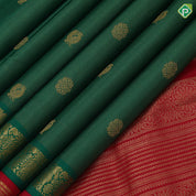 Forest green gold zari vairaoosi peacock chakkaram contrast red gold zari gaja yaali butta border traditional vintage silk saree