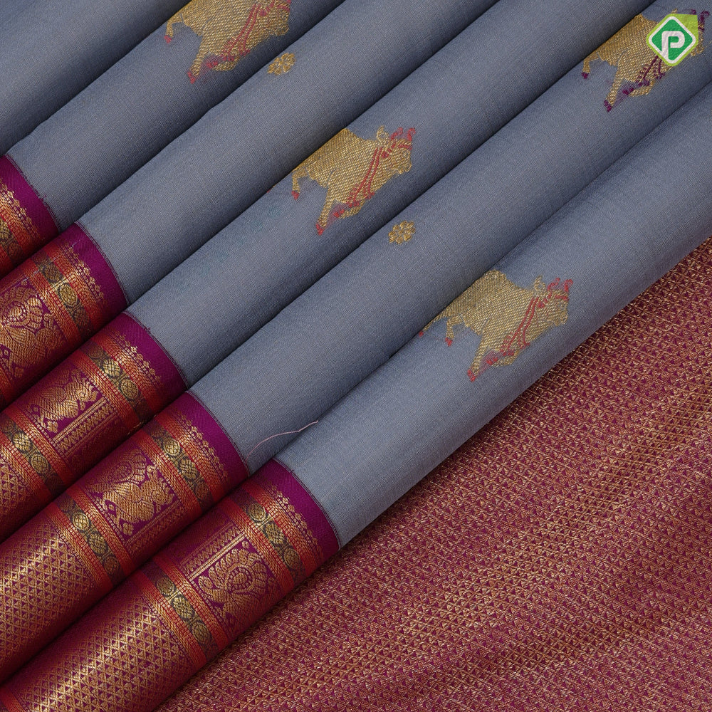 blueish grey gold zari thread work cow butta design contrast purple gold peacock butta mayilkan border pichwai silk saree