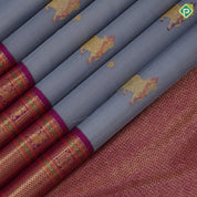 blueish grey gold zari thread work cow butta design contrast purple gold peacock butta mayilkan border pichwai silk saree