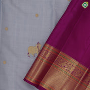 blueish grey gold zari thread work cow butta design contrast purple gold peacock butta mayilkan border pichwai silk saree