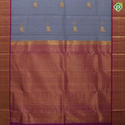 blueish grey gold zari thread work cow butta design contrast purple gold peacock butta mayilkan border pichwai silk saree