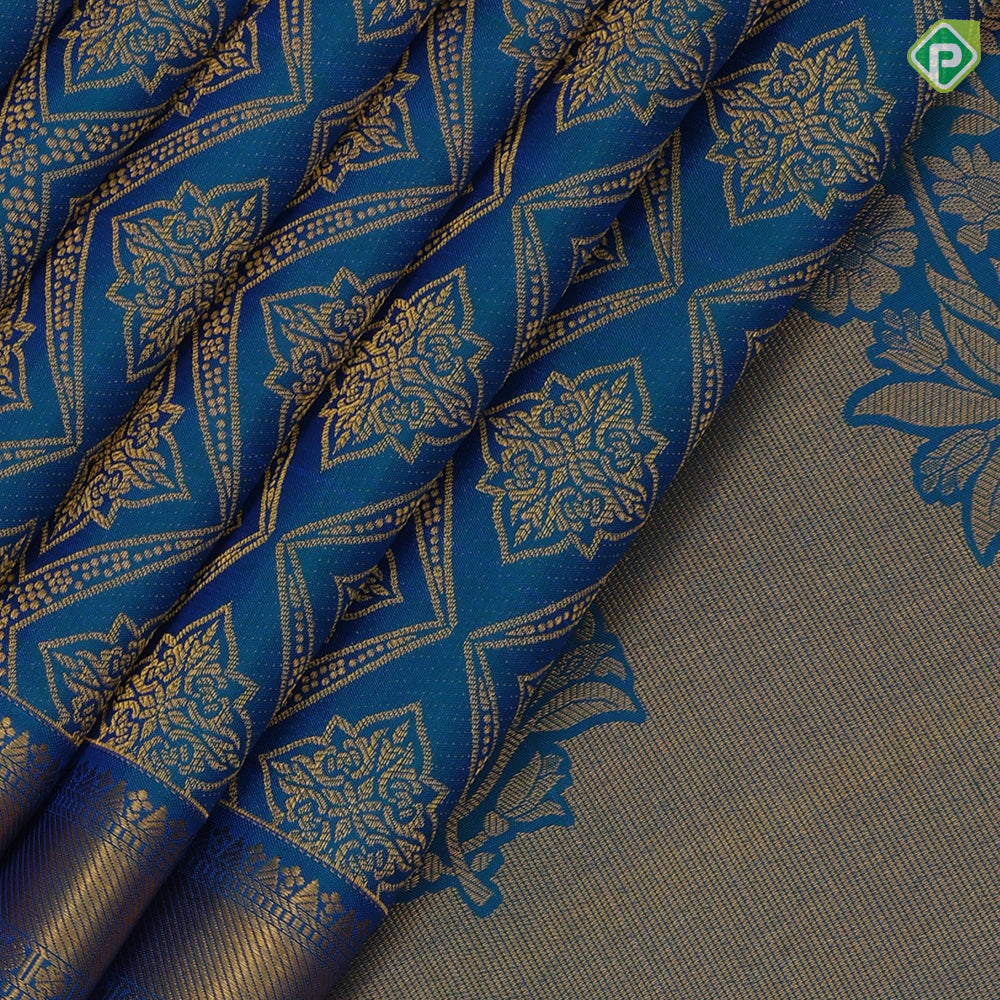 Peacock blue gold zari grand star diamond self gold zari rangoli border bridal silk saree
