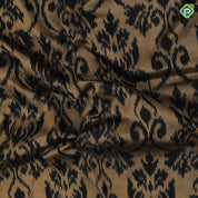 golden base black ikkat design black plain border ikkat design silk saree