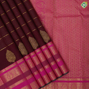 Dark maroon gold zari velthari lines thilagam butta rani pink gold zari peacock thilagam butta lines border traditional silk saree