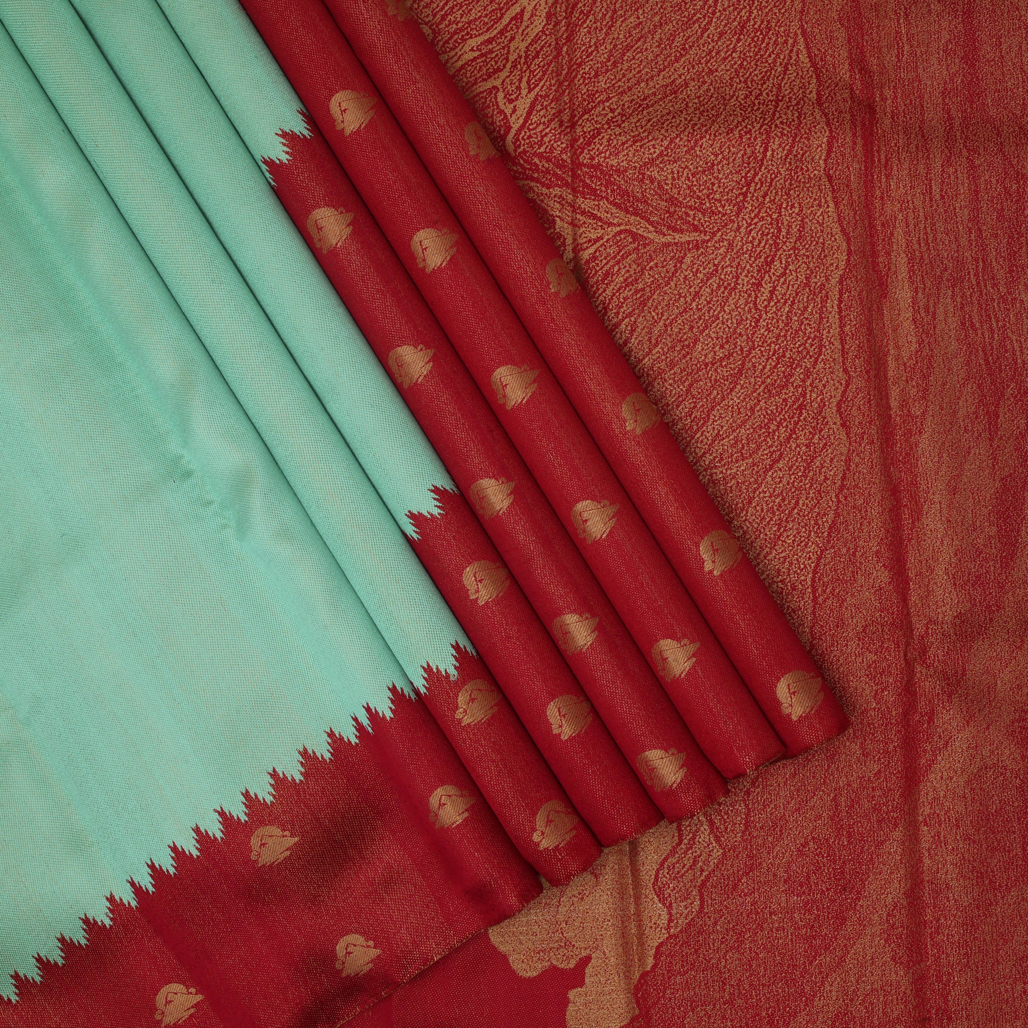 Crimson red gold zari Kailash hills design contrast pista green raising design border trendy signature silk saree