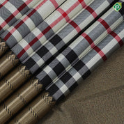 Cream base multi color barbarian chennai checks design Black with gold zari zig zag border Traditional silk saree