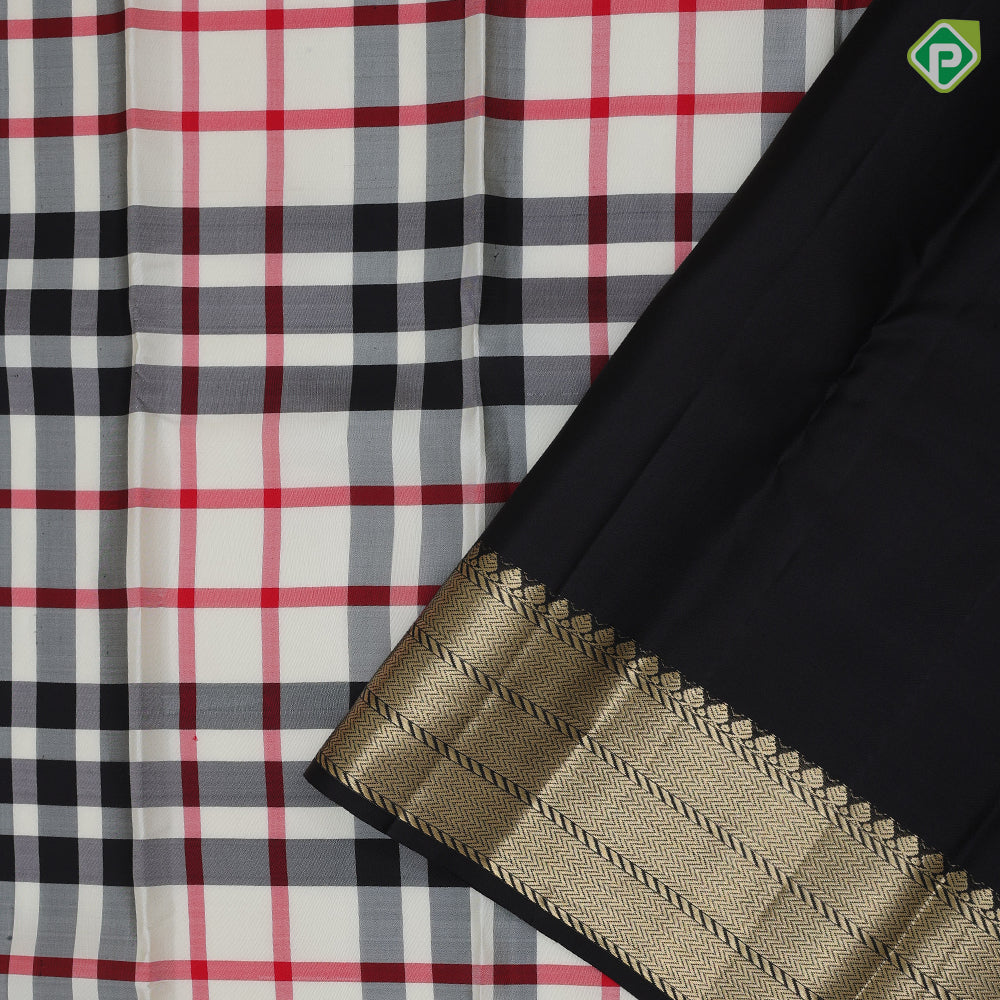 Cream base multi color barbarian chennai checks design Black with gold zari zig zag border Traditional silk saree