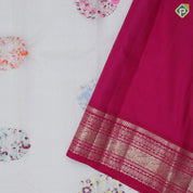 Cream color silver zari flying bird and flower round butta rani pink silver gold zari border linen kora silk saree