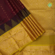 Maroon red gold zari lines thilagam buttas design Lemon yellow gold zari border silk cotton saree