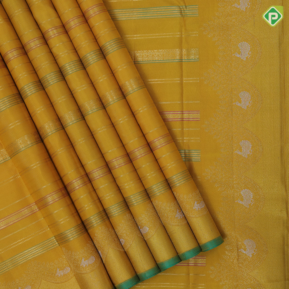 Golden yellow silk thread and gold zari velthari lines self gold zari thoranam design green edge border vintage silk saree