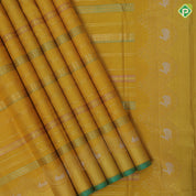 Golden yellow silk thread and gold zari velthari lines self gold zari thoranam design green edge border vintage silk saree