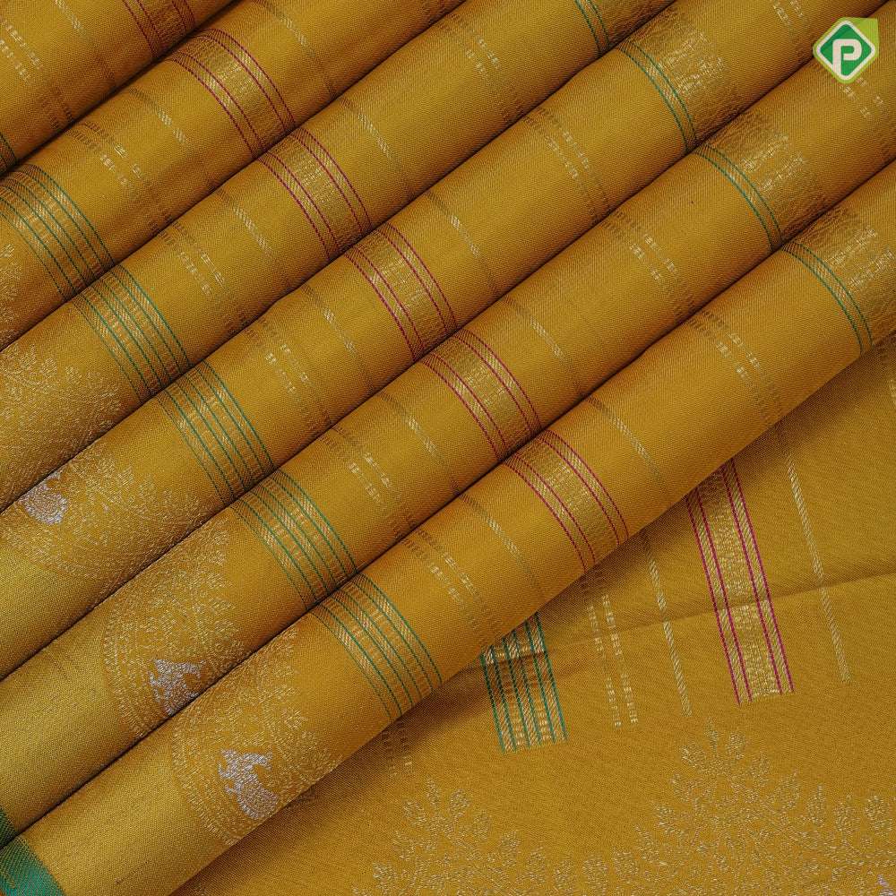 Golden yellow silk thread and gold zari velthari lines self gold zari thoranam design green edge border vintage silk saree