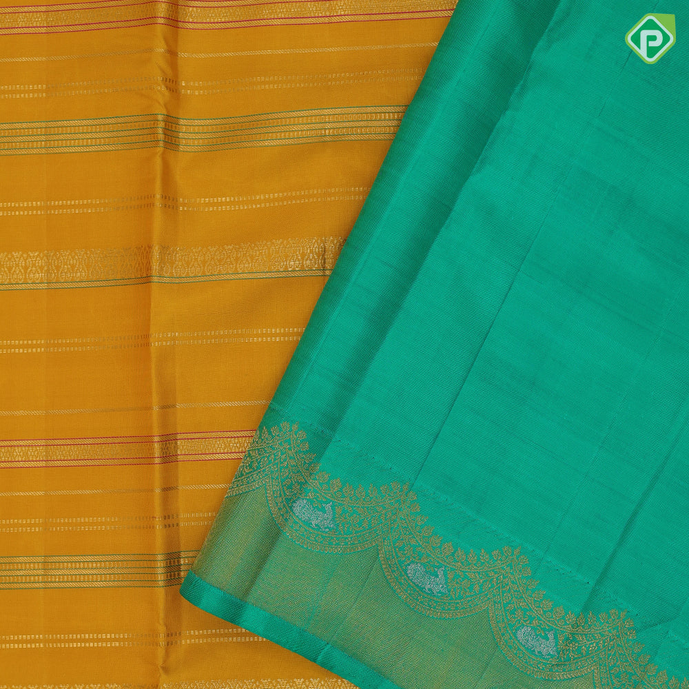 Golden yellow silk thread and gold zari velthari lines self gold zari thoranam design green edge border vintage silk saree