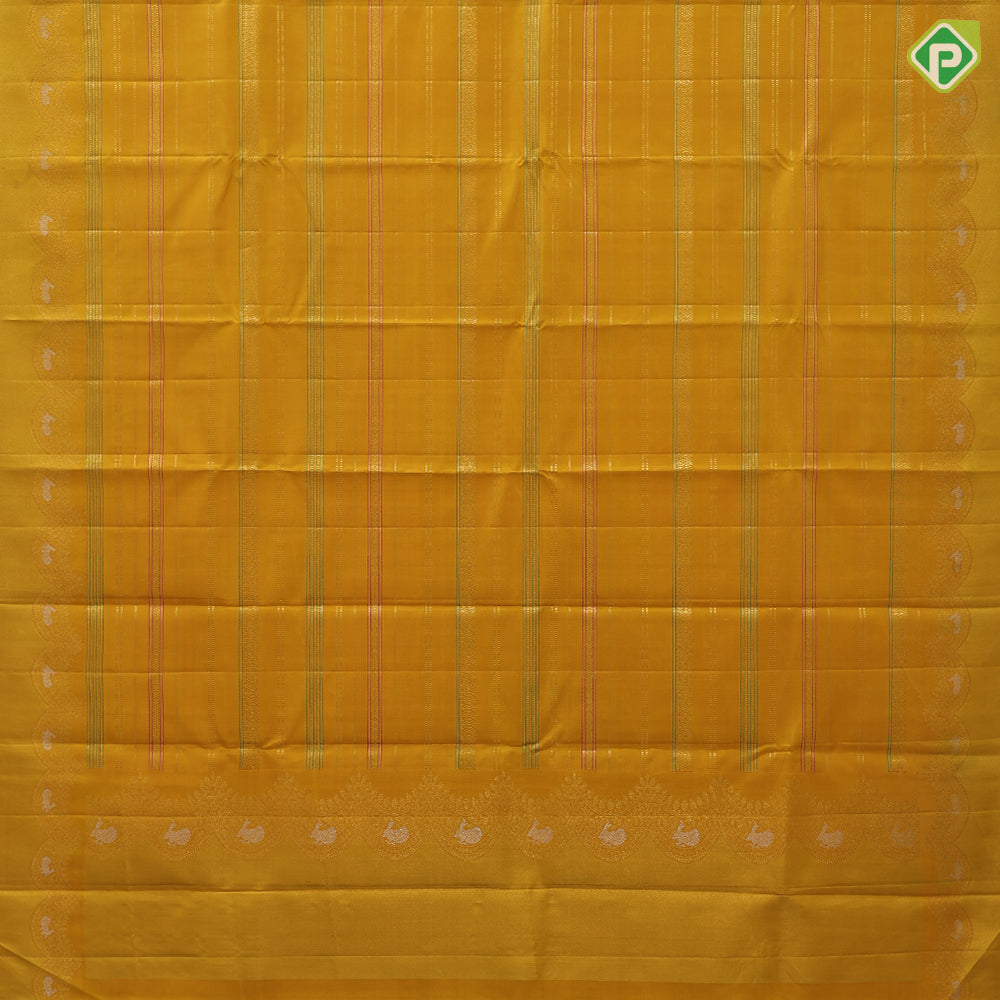 Golden yellow silk thread and gold zari velthari lines self gold zari thoranam design green edge border vintage silk saree
