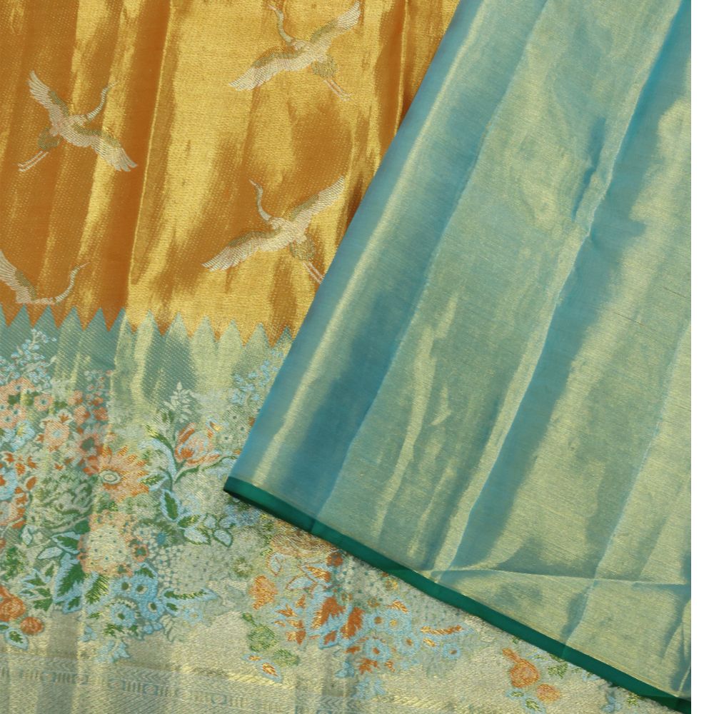 Orange silver zari swan meena work contrast green jaamthani border bridal tissue silk saree