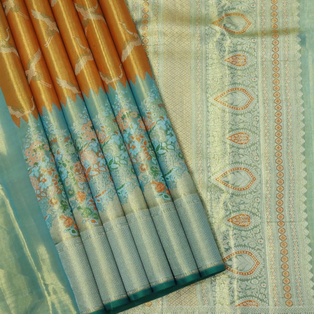 Orange silver zari swan meena work contrast green jaamthani border bridal tissue silk saree