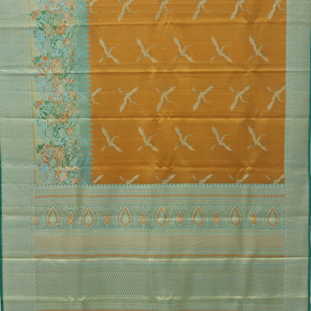 Orange silver zari swan meena work contrast green jaamthani border bridal tissue silk saree