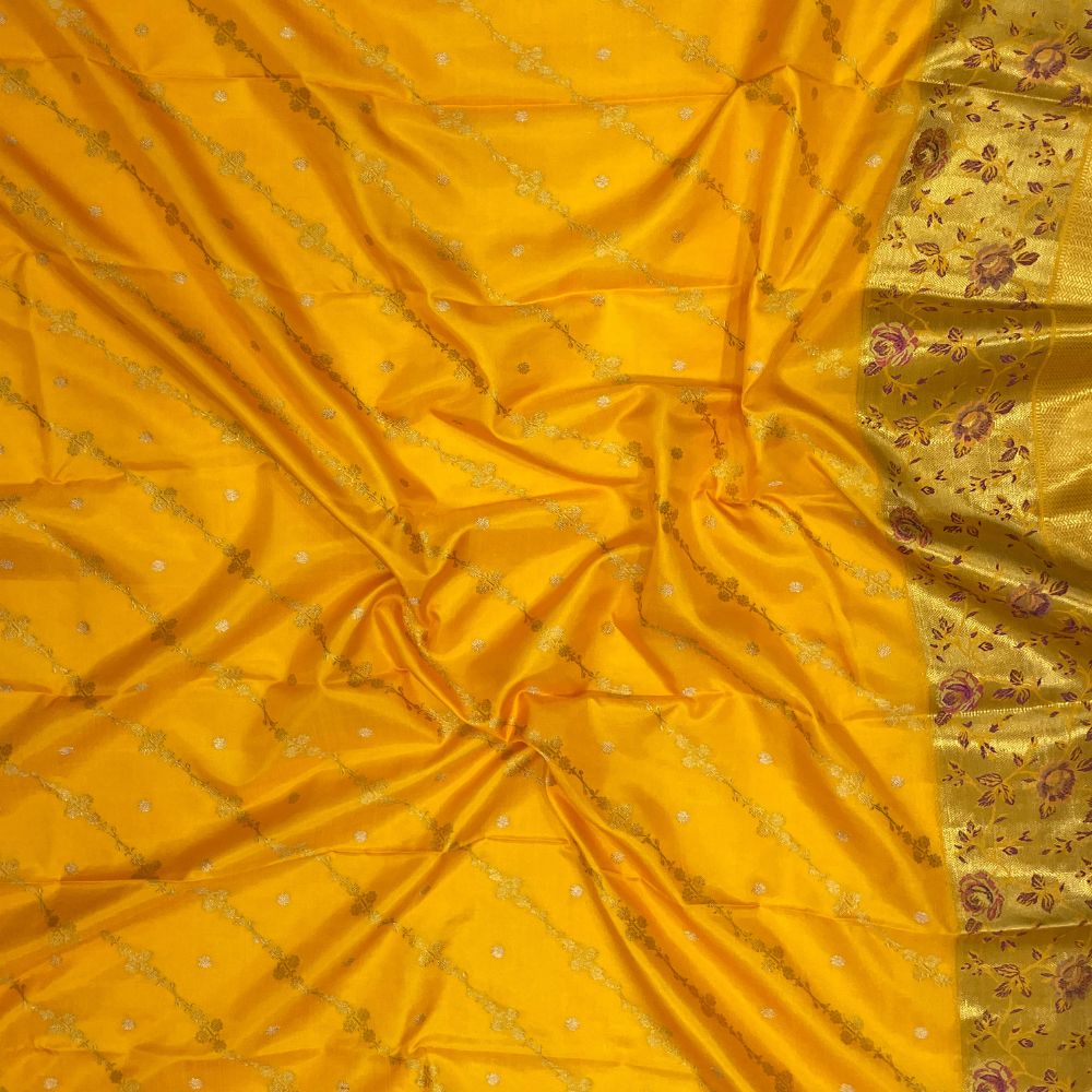 Orangish Yellow Silk Thread Pythonic Design Border Exclusive Grand Silk Saree