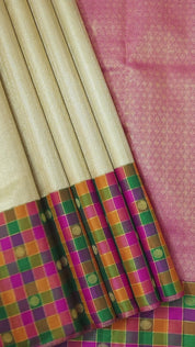 Creamy gold zari by zari weaved design multi colour checks border Traditional silk saree