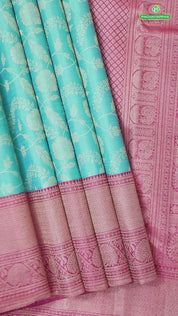 Cool green silver gold zari grand floral design contrast pink border grand bridal silk saree