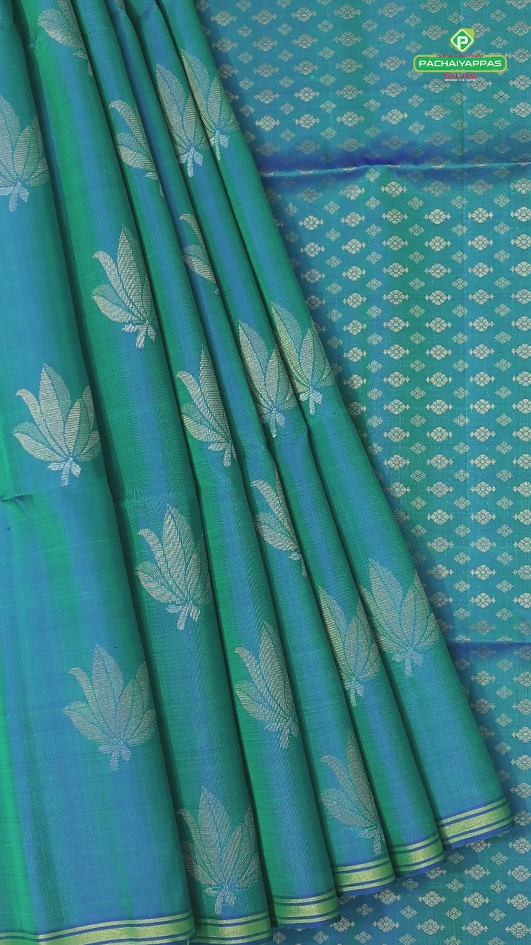 Peacock blue fancy lotus butta design self gold zari border grand pallu soft silk saree