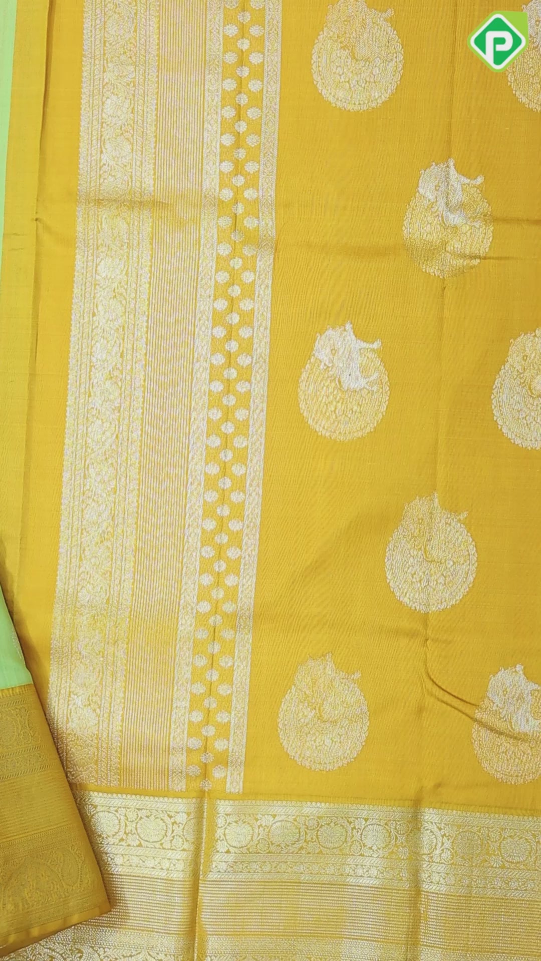 Cardamon green silver gold zari double cone butta mustard yellow silver gold zari rangoli border traditional silk saree