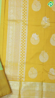 Cardamon green silver gold zari double cone butta mustard yellow silver gold zari rangoli border traditional silk saree