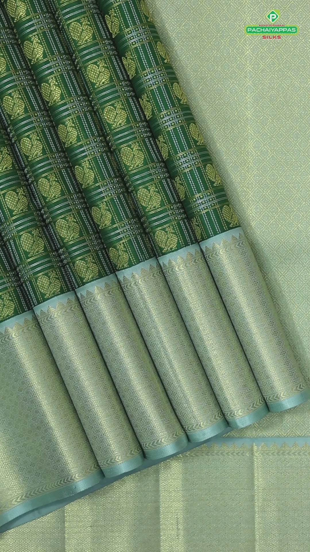 Dark green with peacock butta silver and gold zari checkered sea foam green border traditional silk saree