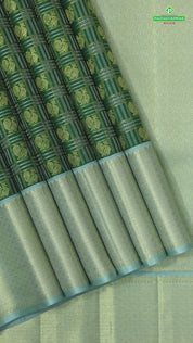 Dark green with peacock butta silver and gold zari checkered sea foam green border traditional silk saree