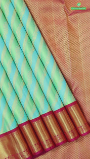 Pista green sky blue and gold zari cross lines design contrast pink gold zari border grand bridal silk saree